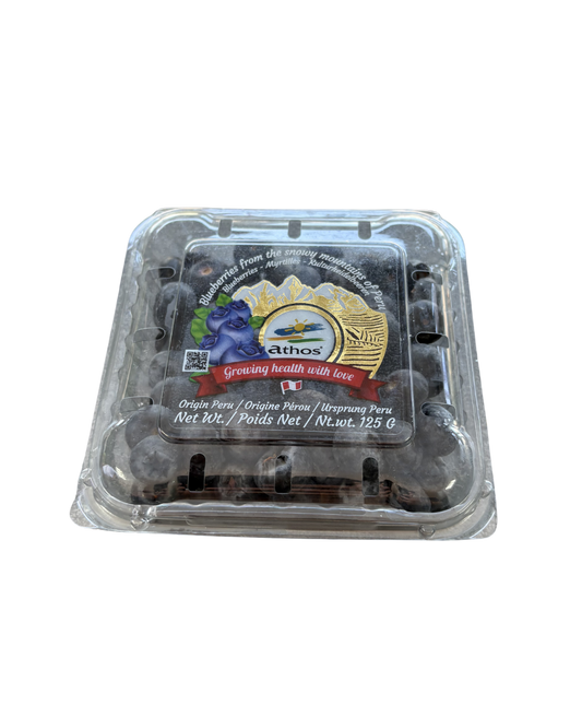 Packaged blueberries in a clear plastic container with a brand label on a white background