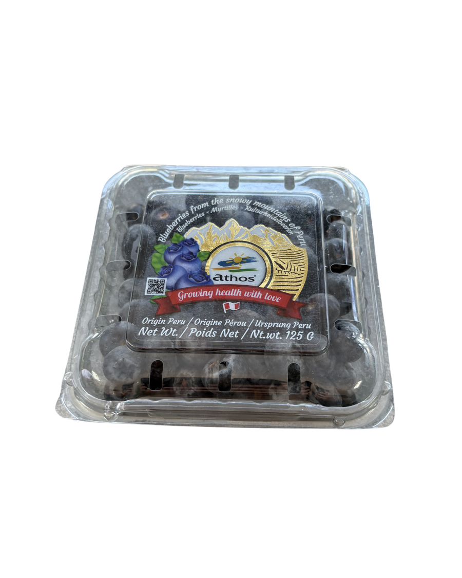 Packaged blueberries in a clear plastic container with a brand label on a white background