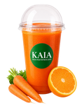 Deep Orange & Carrot juice in a clear plastic cup with a KAIA label, surrounded by carrots and an orange.
