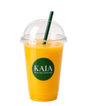 Orange juice in a clear plastic cup with a green straw and 'KAIA' logo 