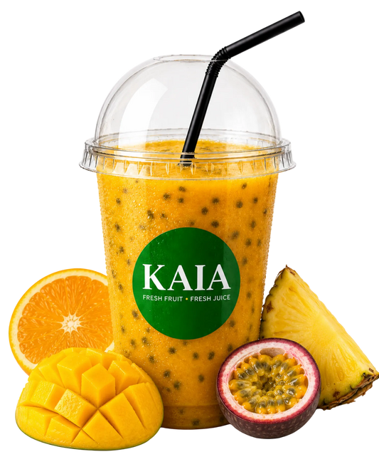 Orange smoothie in a clear cup with a black straw, surrounded by an orange, mango, passionfruit and pineapple. KAIA brand on the cup